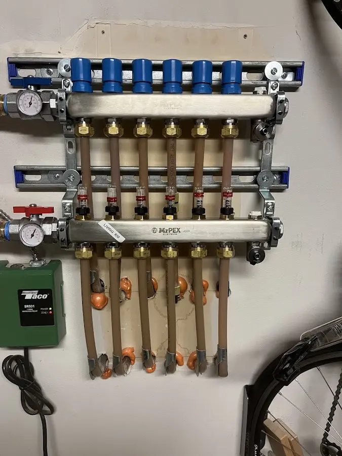 Plumber performing Gas Leak Detection at a residential property in Winooski